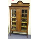 An Edwardian mahogany display cabinet with inlaid decoration, fitted with two astragal glazed