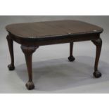 A George V mahogany "Celerity" extending dining table, patent No. 344984, the curved rectangular top