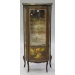 An early 20th century French vernis Martin walnut and gilt metal mounted vitrine, the bow front with