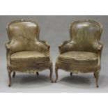 A pair of 20th century Louis XV style beech fauteuil armchairs, the showframes with painted
