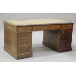 A Victorian mahogany twin pedestal desk, the moulded top inset with a leather writing surface