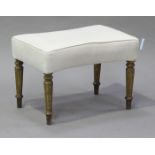 A late 19th century waisted rectangular shaped stool, the overstuffed seat on turned tapering and