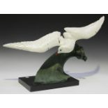 After Henri Lechesne - an Art Deco painted spelter model of a gull on the crest of a wave, bearing