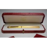 A Must de Cartier gold plated fountain pen, cased, together with guarantee, leather slip case and