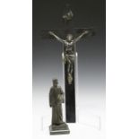 An early 20th century patinated cast spelter figure of Dante, standing on a green hardstone