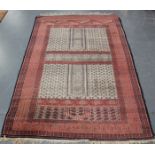 A Pakistan ensi style rug, mid/late 20th century, the compartmentalized taupe field with overall