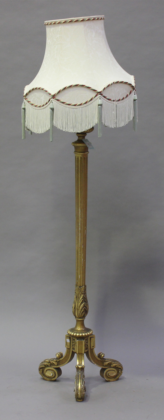 An early 20th century giltwood and gesso lamp standard with reeded sconce and tapering stop fluted