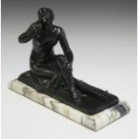 Suzanne Bizard - an early 20th century French dark green patinated cast bronze figure of a seated