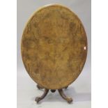 A mid-Victorian burr walnut and foliate inlaid oval tip-top breakfast table, raised on fluted and