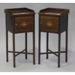 A pair of late 19th century George III style mahogany bedside cupboards, each fitted with a three-