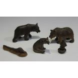 A group of three early 20th century Swiss Black Forest carved softwood models of bears, length of