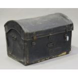 An early 20th century leather-bound dome top travelling trunk, bearing label 'Manufactured by W.