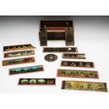 A group of various printed glass magic lantern slides and two mechanical kaleidoscopic slides.