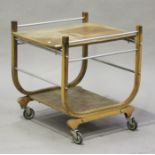 An Art Deco walnut two-tier drinks trolley, height 70cm, width 68cm, depth 62cm.Buyer’s Premium 29.