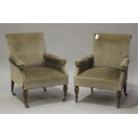 A pair of Edwardian armchairs, upholstered in green velour, on turned legs and china castors, height