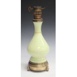 A late 19th century French pale yellow opaline glass and gilt brass mounted table lamp, height