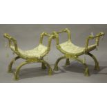 A pair of 20th century Neoclassical style giltwood 'X' frame stools, decorated with leaf sprays