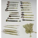 A group of mainly late 19th century bobbins, including nine bone and ivory bobbins, some bearing