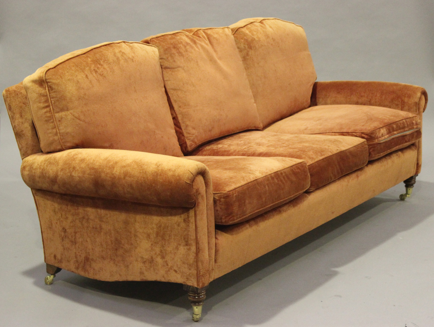 A modern three piece suite, upholstered in terracotta velour, comprising two armchairs and a three - Image 2 of 2