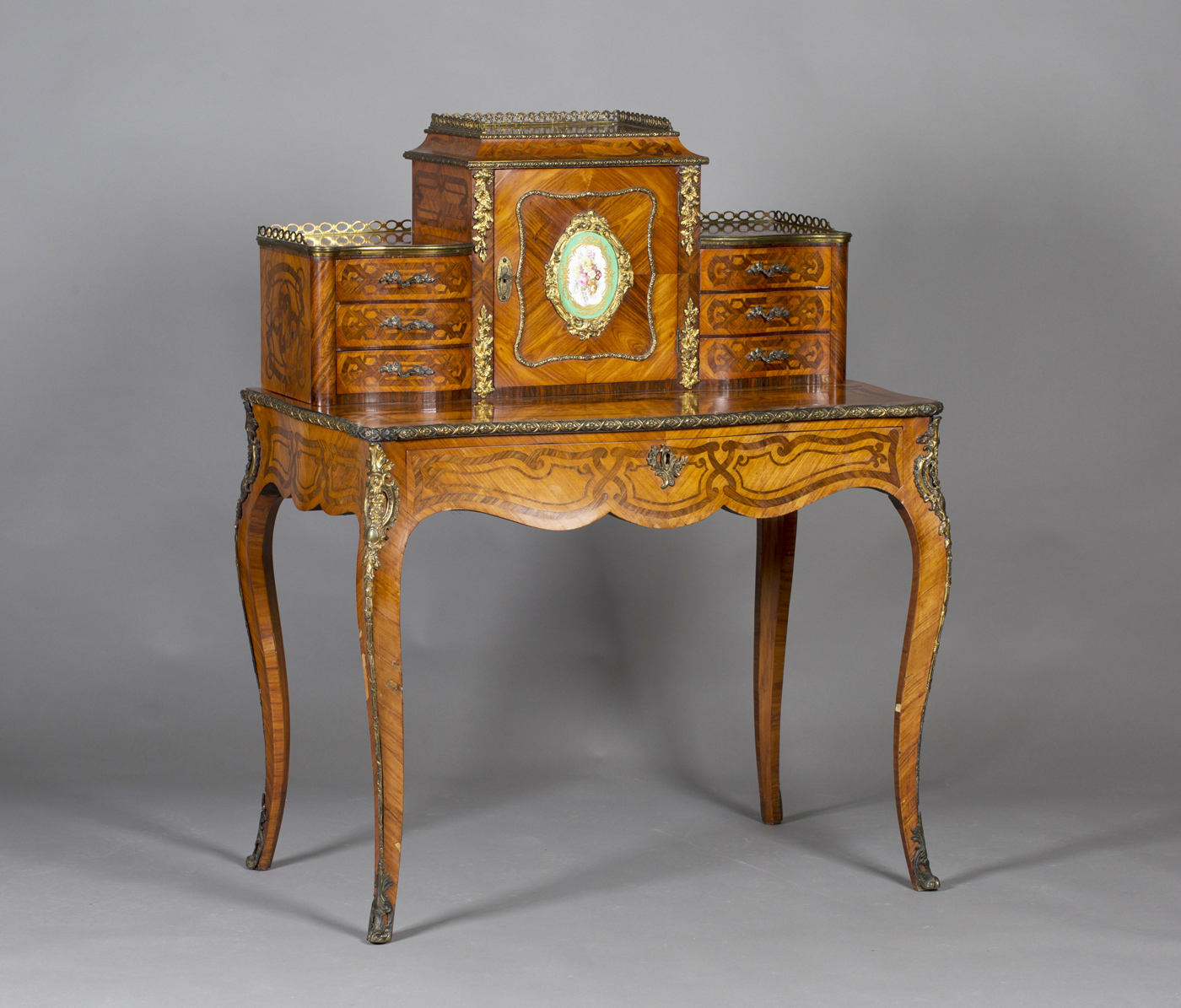 A mid-19th century Louis XV style kingwood bonheur-du-jour with rosewood banding of interwoven