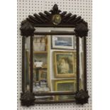A late 19th/early 20th century tramp art sectional wall mirror, the frame with overall geometric