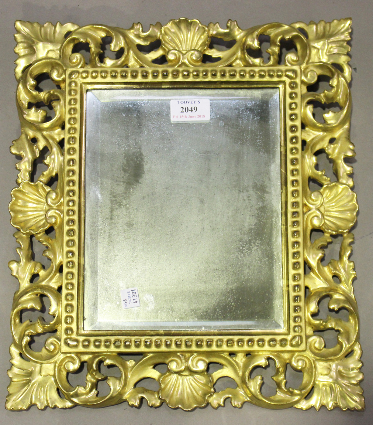 A 20th century Florentine giltwood rectangular wall mirror, 39cm x 34cm. Provenance: from the estate