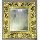 A 20th century Florentine giltwood rectangular wall mirror, 39cm x 34cm. Provenance: from the estate