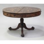 A Regency rosewood drum-top centre table, the crossbanded top above a frieze fitted with five