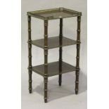 An early 20th century French mahogany three-tier étagère, the top inlaid in brass with leaf scrolls,