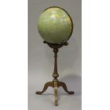 A mid/late 20th century Philips' terrestrial floor standing globe, diameter 48cm, raised on a turned