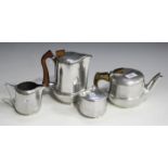 A mid-20th century Piquot ware four piece tea set, comprising teapot, hot water pot, sugar and