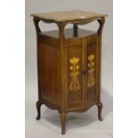 An Edwardian Art Nouveau mahogany side cabinet, in the manner of Liberty & Co, the serpentine shaped