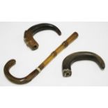 Two 19th century rhino horn walking stick handles of curved form, lengths 11cm, total weight 122g,