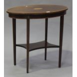 An Edwardian mahogany oval occasional table, crossbanded in satinwood, on square tapering legs
