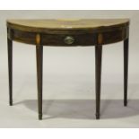 A George III mahogany demi-lune tea table, the hinged top above a single frieze drawer inlaid with