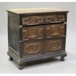 A 17th century stained pine chest with applied geometric mouldings, fitted with three long