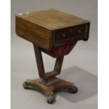 A Victorian mahogany drop-flap work table, fitted with a drawer and well, on a platform base, height