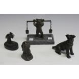 A mid-20th century brown patinated cast bronze model of a seated terrier, height 9.5cm, another