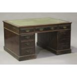 A late Victorian mahogany partners desk by Maple & Co, the moulded top inset with green leather
