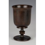 A mid-19th century turned treen goblet with an overall rich dark brown patina, height 15.5cm.Buyer’s