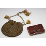 A 19th century velvet and silver thread embroidered purse of circular form, width 16cm, together