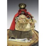 A late 19th/early 20th century pedlar doll, the jointed wooden body with painted hair and face,