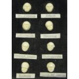 A set of eight late 19th century carved ivory novelty buttons, each modelled as the face of a