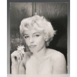 BEATON, Cecil. A black and white photograph of Marilyn Monroe holding a daisy, 25.5cm x 20.5cm, '