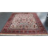 A modern Heriz style carpet, Belgium, the taupe field with overall angular vines, palmettes and