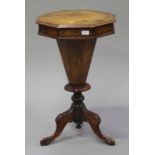 A late Victorian walnut octagonal work table, on a turned column and carved cabriole legs, height