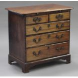 A George III mahogany bachelor's chest, the brushing slide above two short and three long drawers,