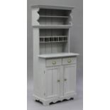 A 20th century grey painted pine kitchen dresser, the shelf back fitted with five moulded glass