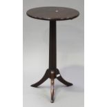 A 19th century and later mahogany circular wine table with a reeded stem and tripod legs, height