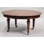 A mid-Victorian mahogany oval extending dining table, raised on beaded knop and turned tapering legs